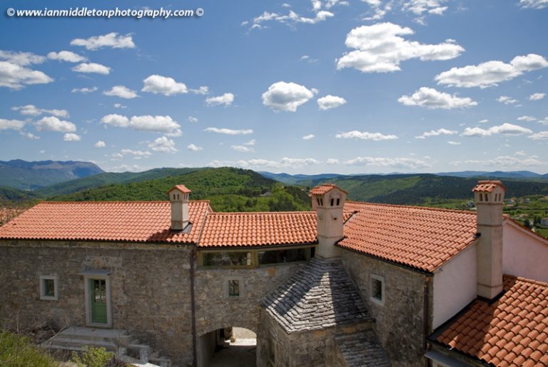Typical red tiled roofs with limetone chimney in Stanjel, Karst region, Slovenia