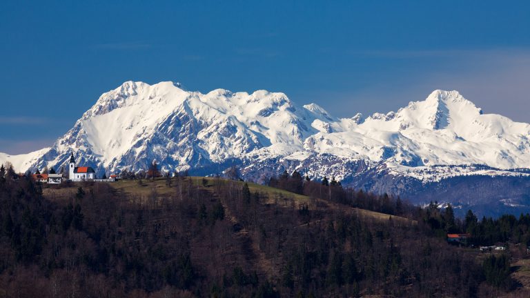 Church of Saint Nicholas with the Kamnik Alps behind
